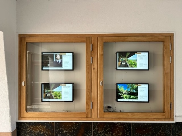 Multiple property displays installed in a storefront
